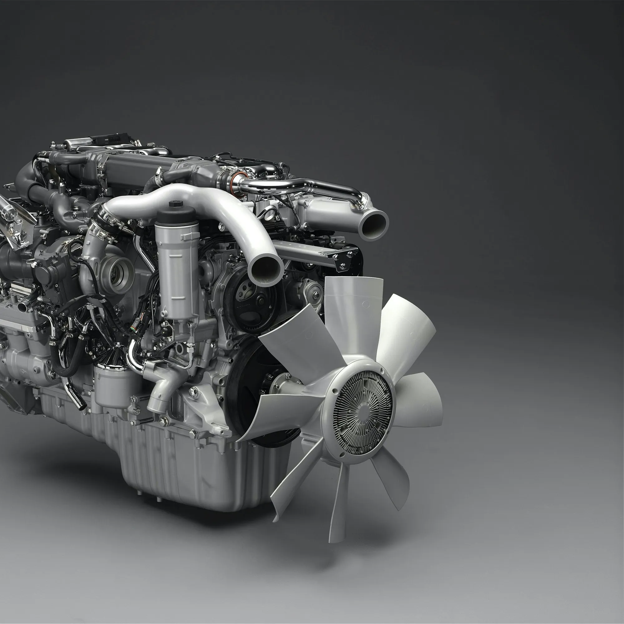 Diesel engine with turbocharger on a gray studio background